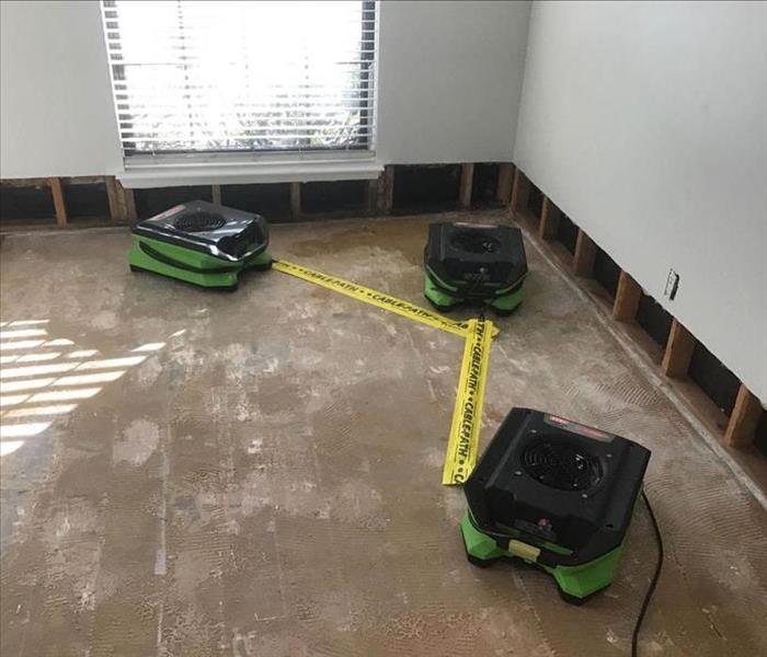 Air movers and flood cuts in a bedroom.
